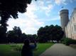 Anne's daughter taking a picture of the Tall Hermann tower with the Estonian tricolor flying on top; in 1975, the iconic tower flew the red Estonian SSR flag.