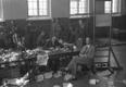Defense League members surrender their arms at the gym of the Tallinn unit of the Defense League on the foot of Toompea Hill. The receiving center was located on the courtyard side of the headquarters. Photo likely from June 18-19, 1940.