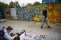 Young artists sprayed their designs on a wall as part of the Poordi Supergraafika project.