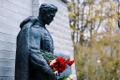 Visitors attending the Bronze Soldier monument in Tallinn on the morning of May 9, 2024.