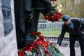 Visitors attending the Bronze Soldier monument in Tallinn on the morning of May 9, 2024.