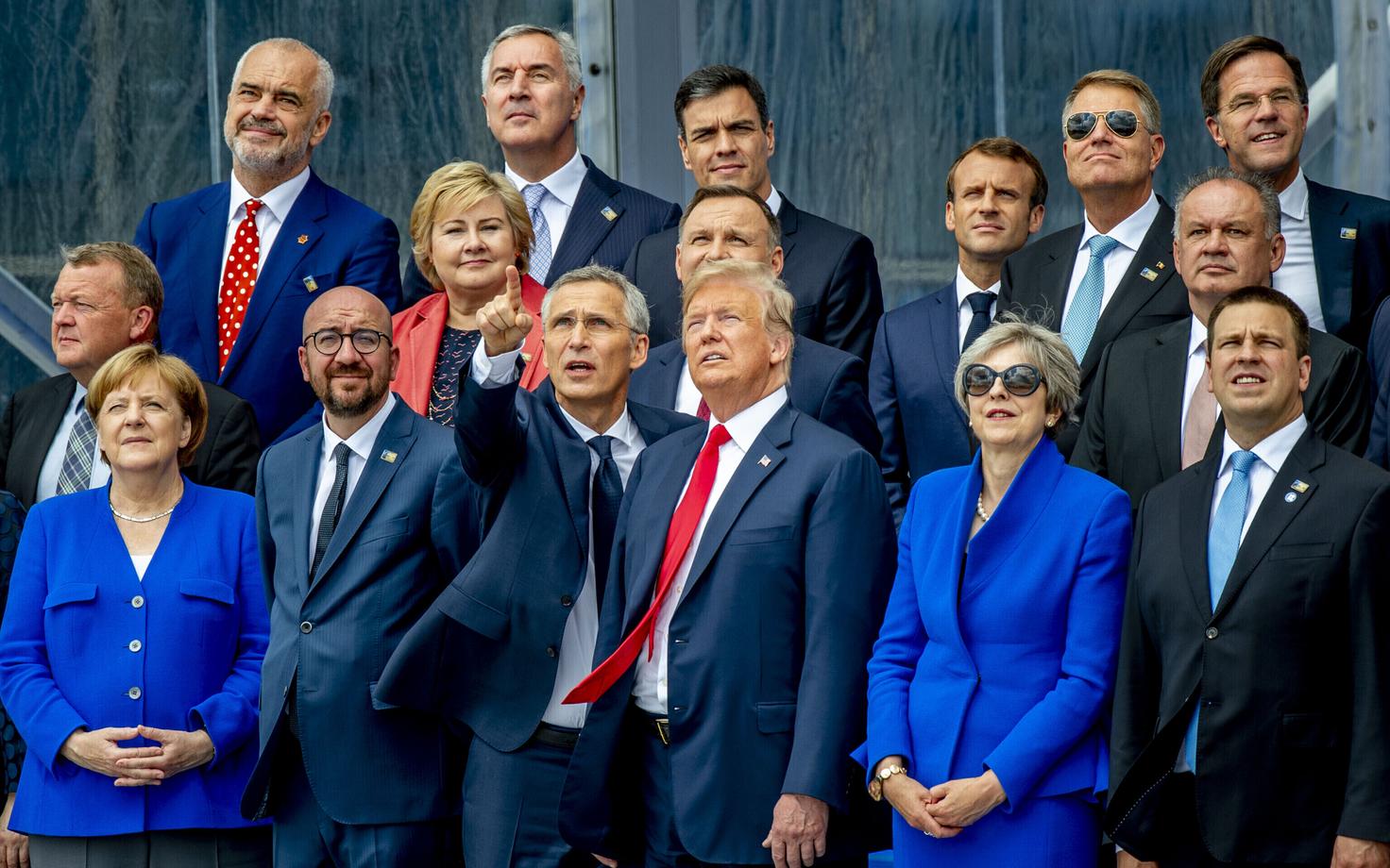 NATO leaders watch a helicopter display at the summit in Brussels yesterday.