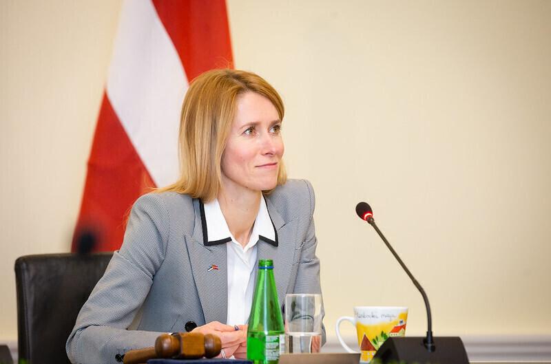 Prime Minister Kaja Kallas and the Latvian flag, during Wednesday's video-linked meeting with that country's prime minister, Krišjānis Kariņš ,