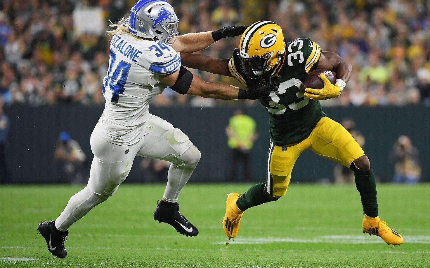 Aaron Jones (paremal) jõudis Detroiti vastu nelja touchdown'ini.