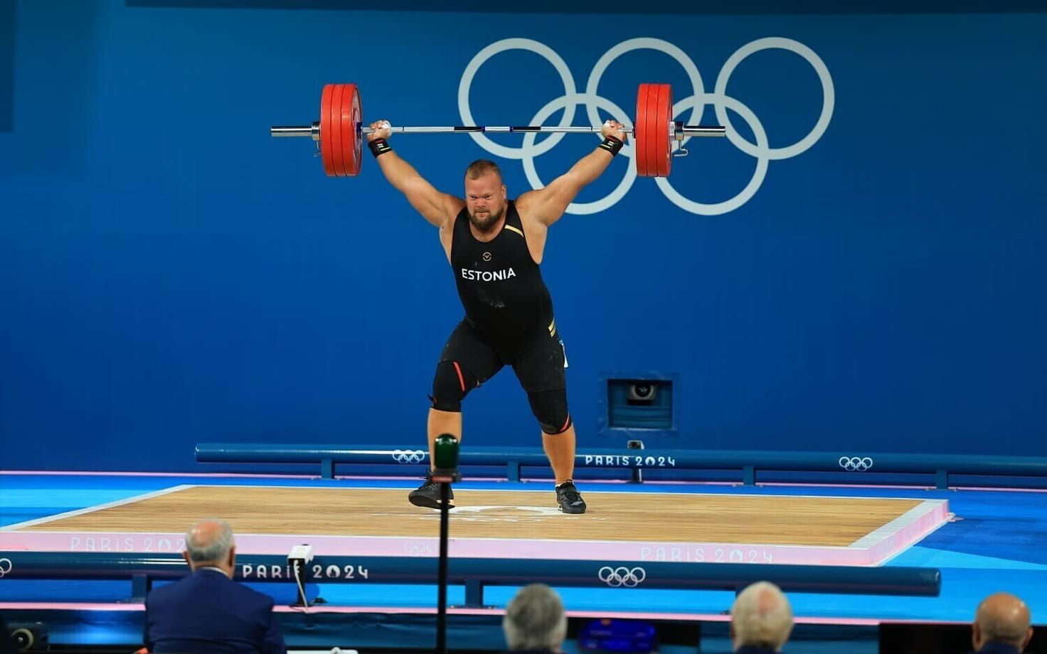 Mart Seim taking part in the Paris Olympics men's +102kg weightlifting final.