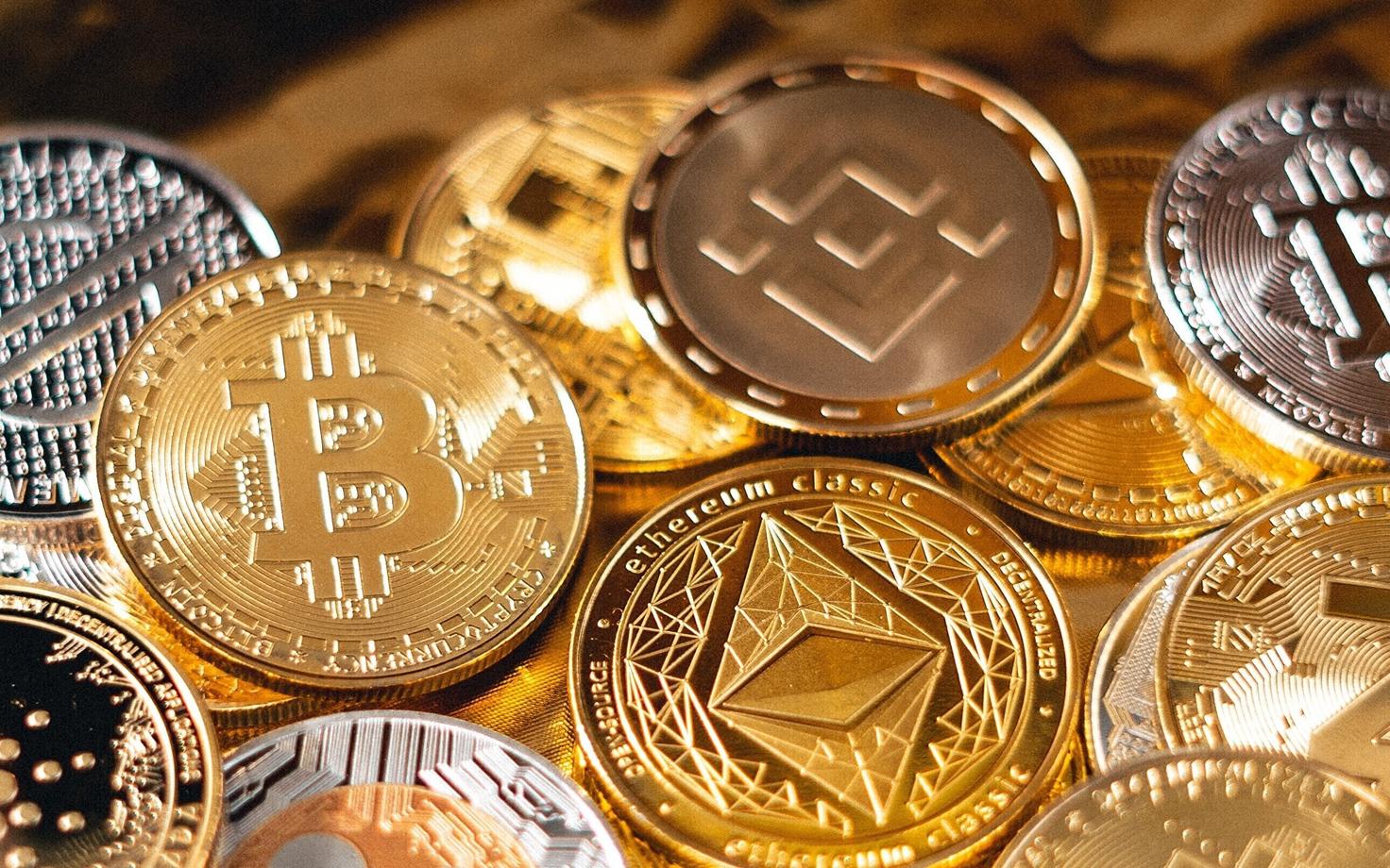 Physical coins representing different types of cryptocurrency (photo is illustrative).