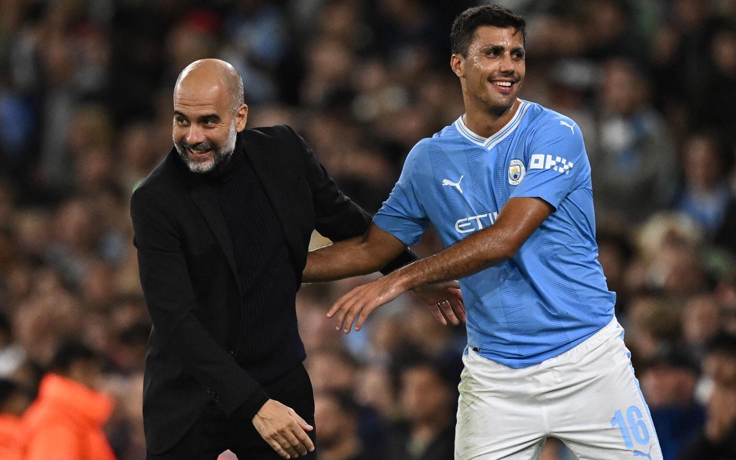 Pep Guardiola ja Rodri.